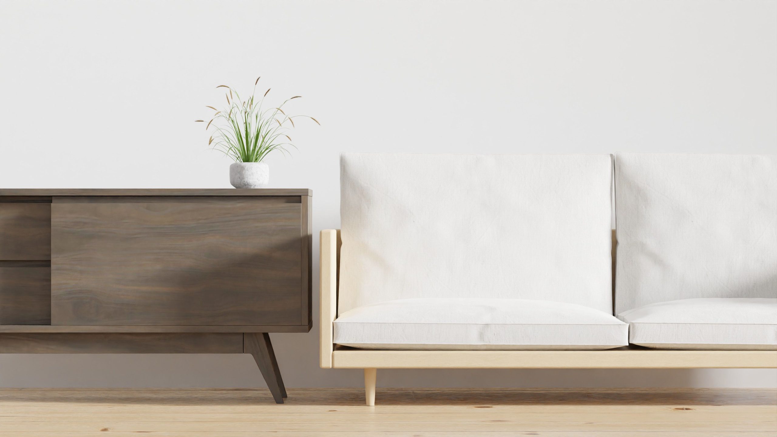 Salon minimaliste avec console bois et canapé beige cosy